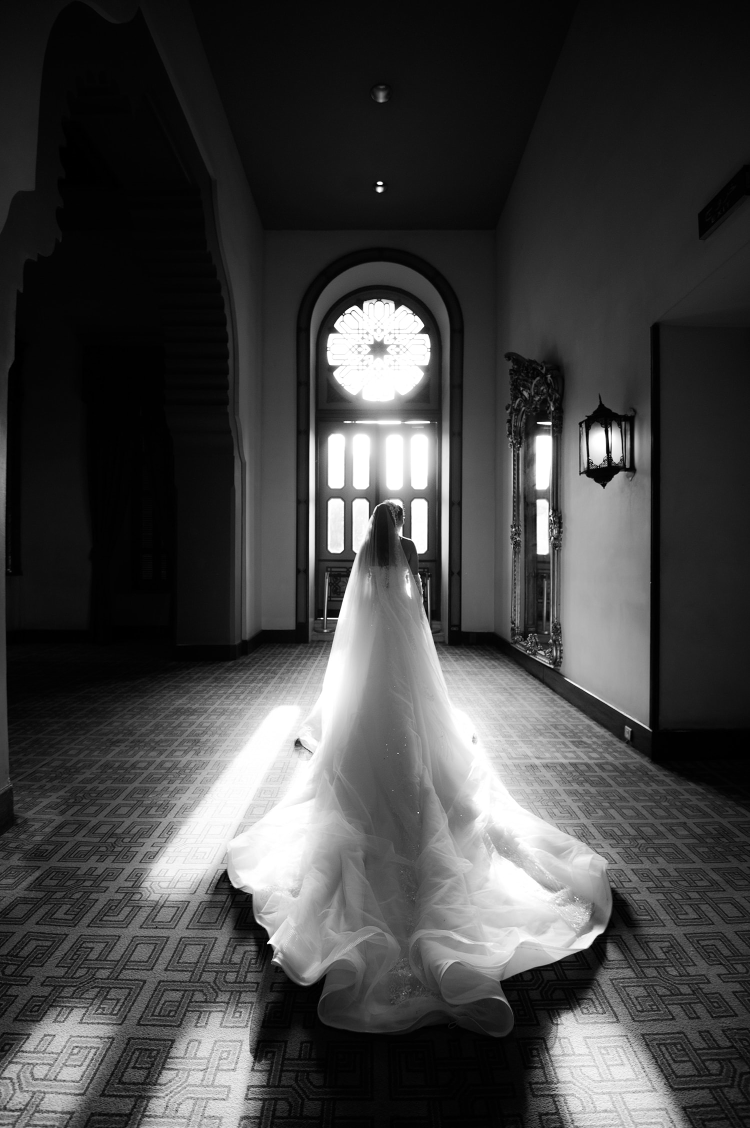 Bride in wedding dress hallway