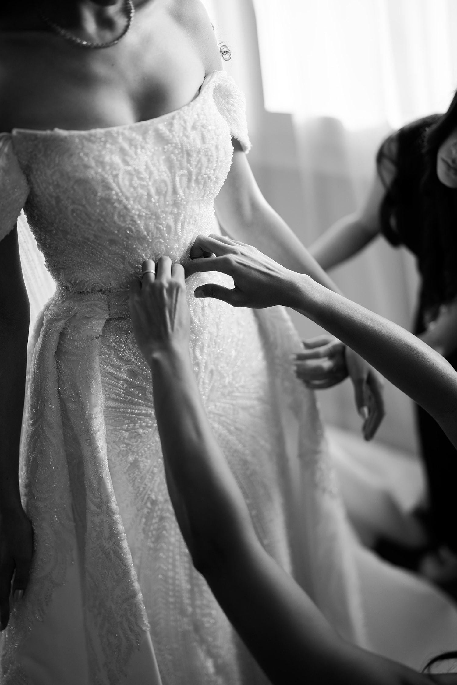 Bride getting dressed wedding day