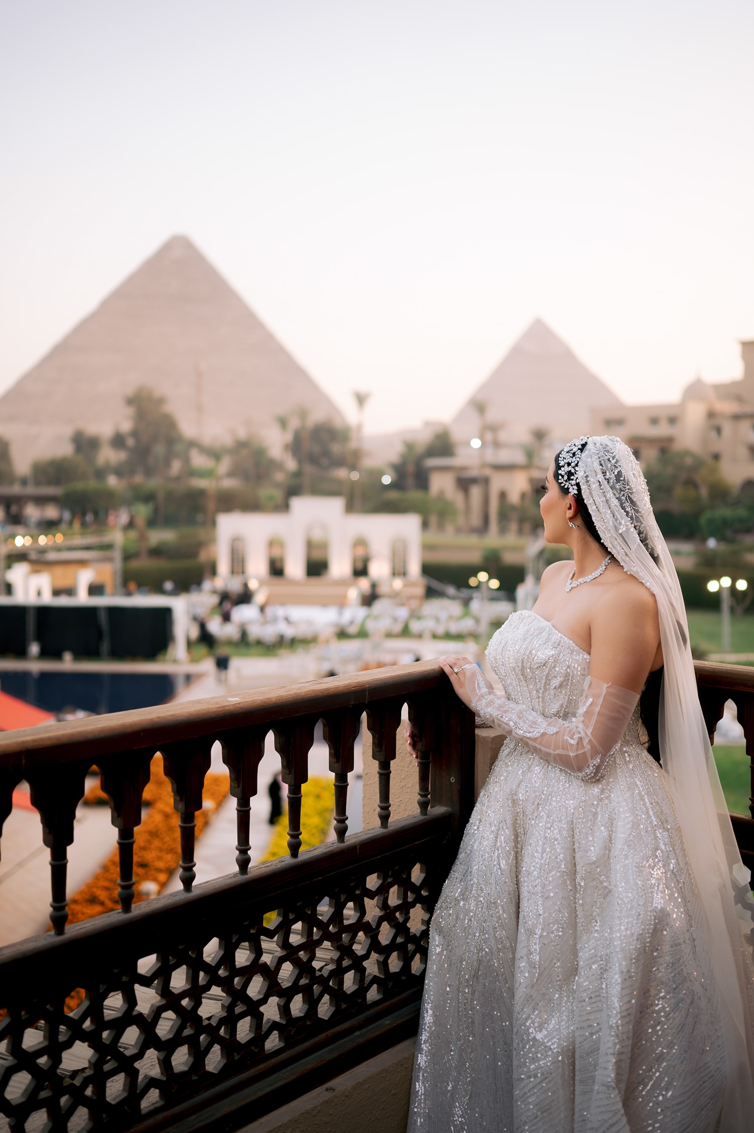 Bride overlooking pyramids Giza Egypt