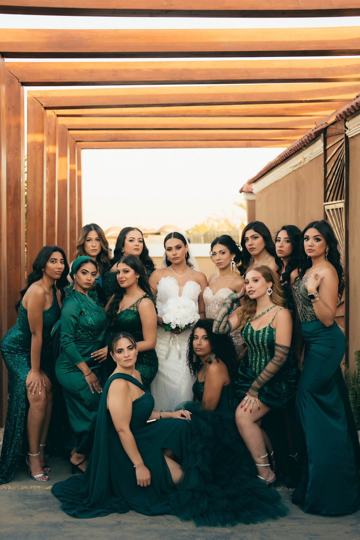 Bride and bridesmaids in emerald dresses