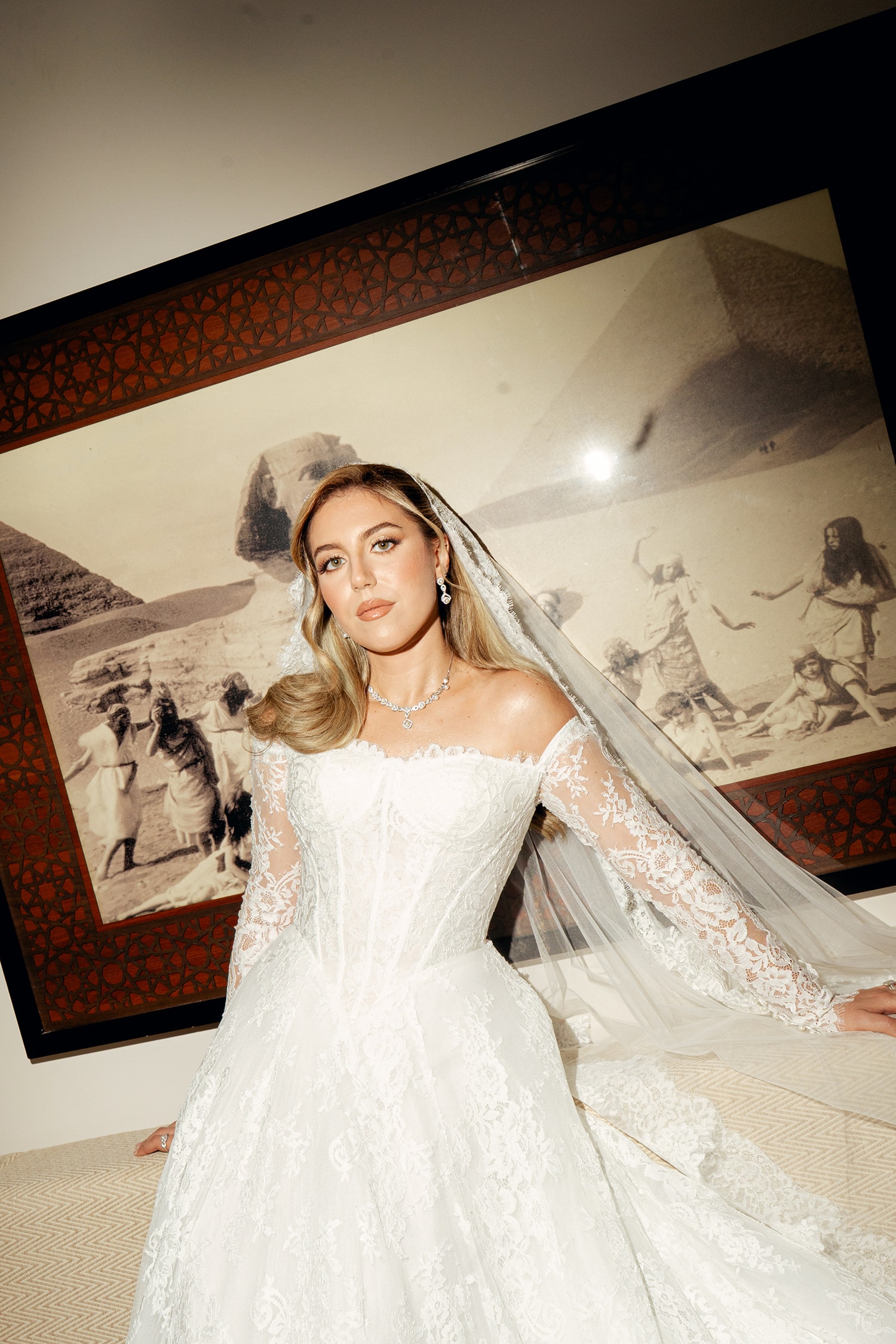 Woman in lace wedding dress with veil