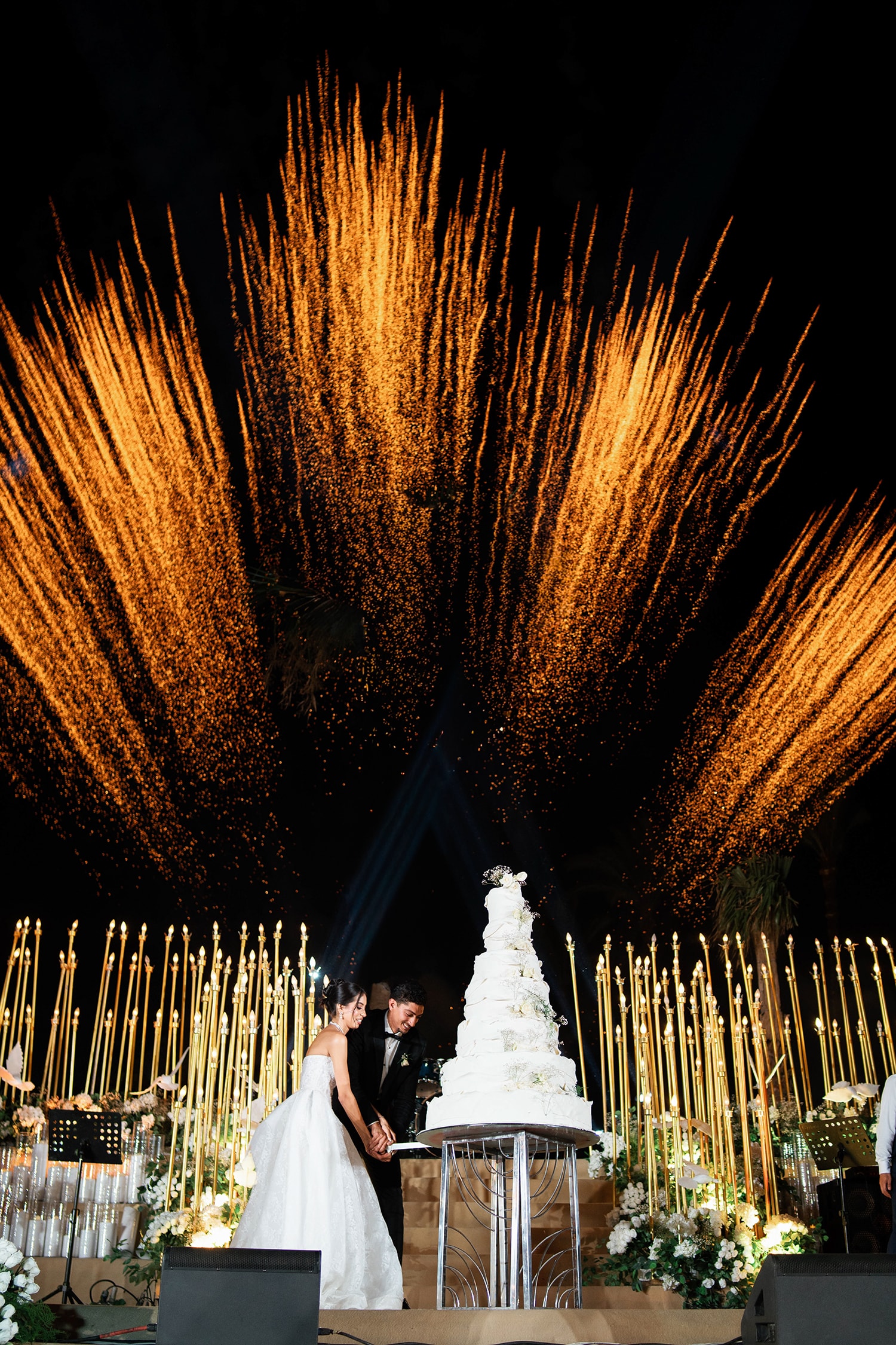 Bride groom descending ornate staircase together