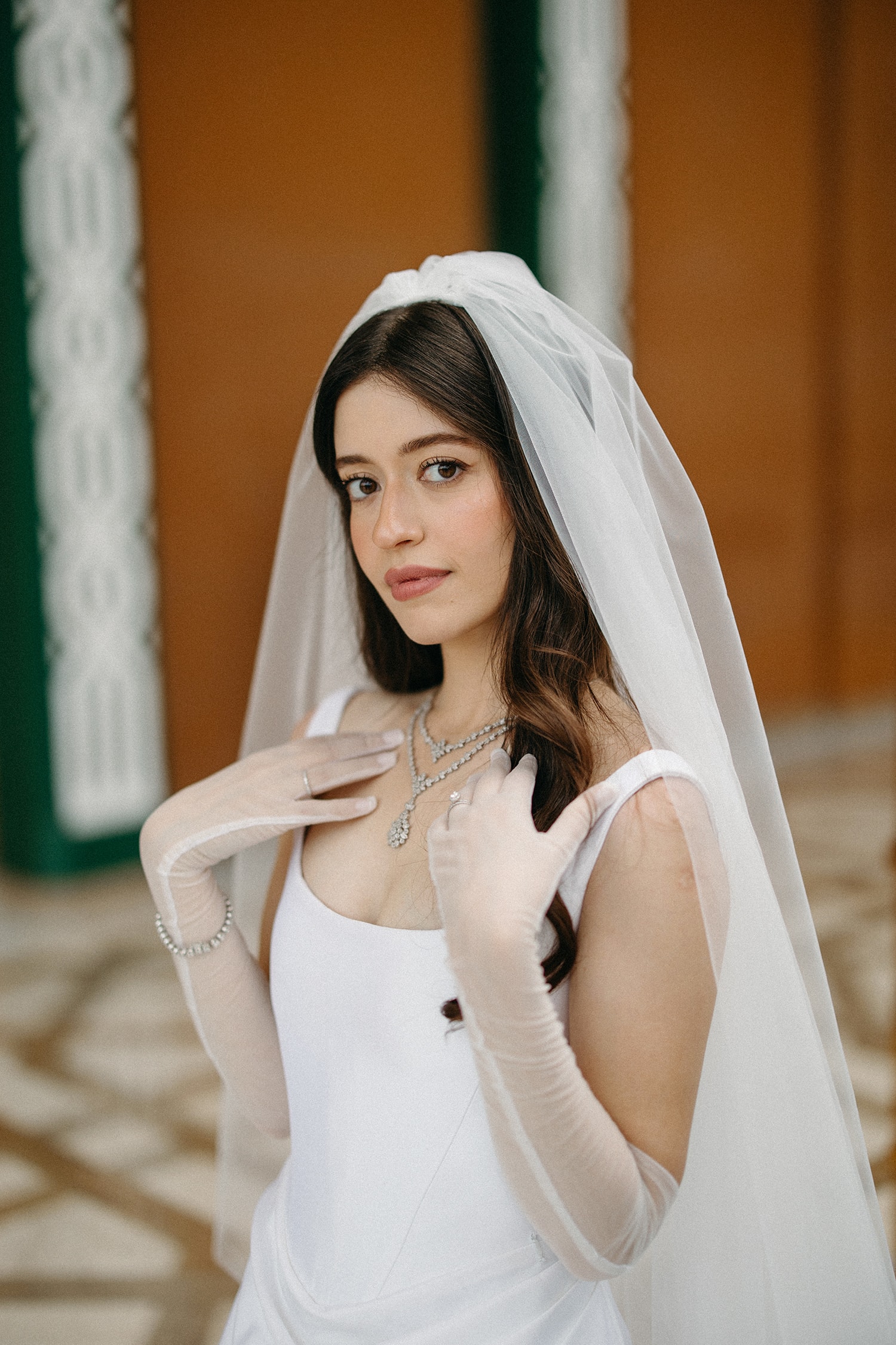Woman in white veil and jewelry portrait