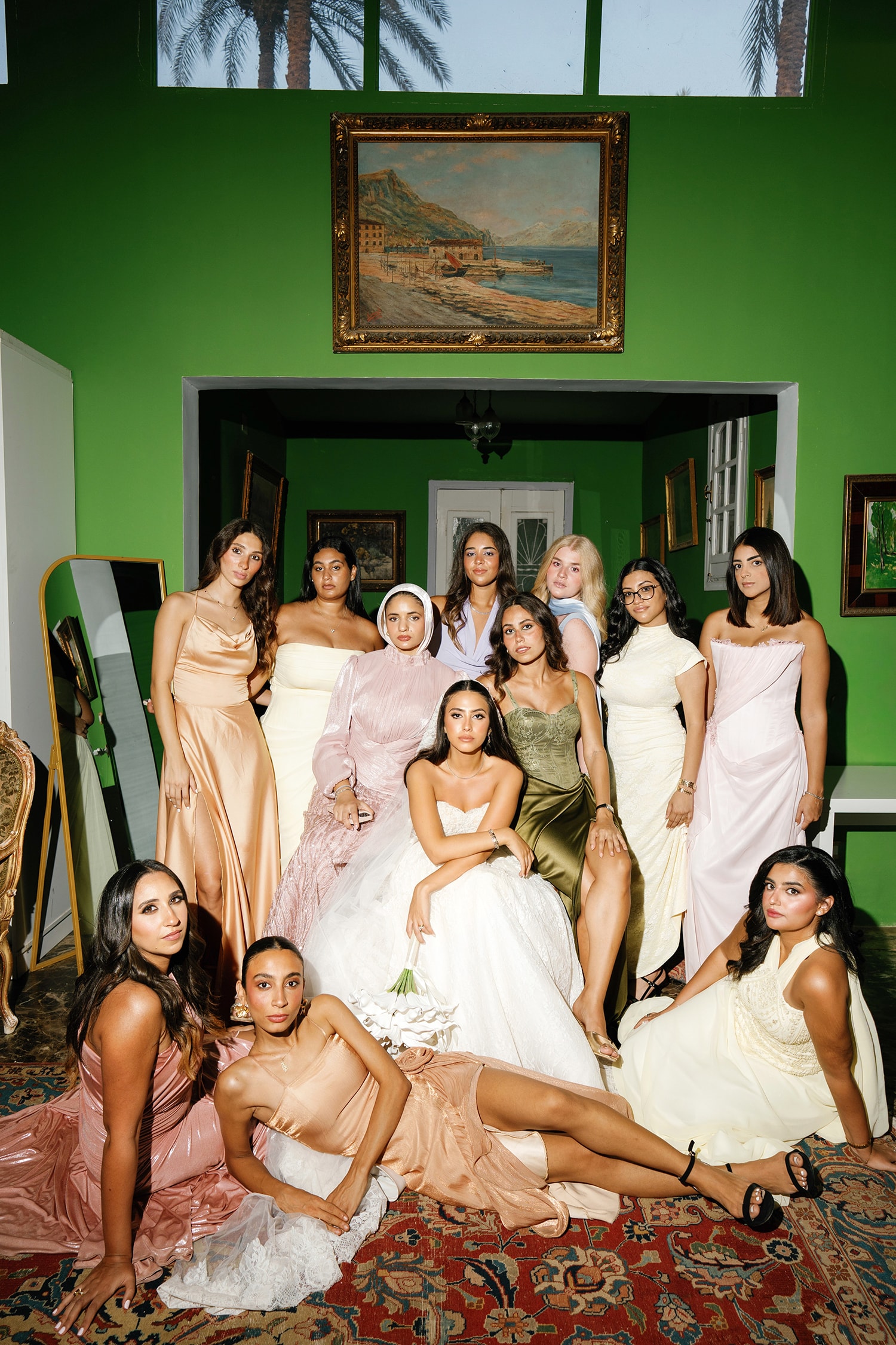 Group of women in formal dresses posing indoors