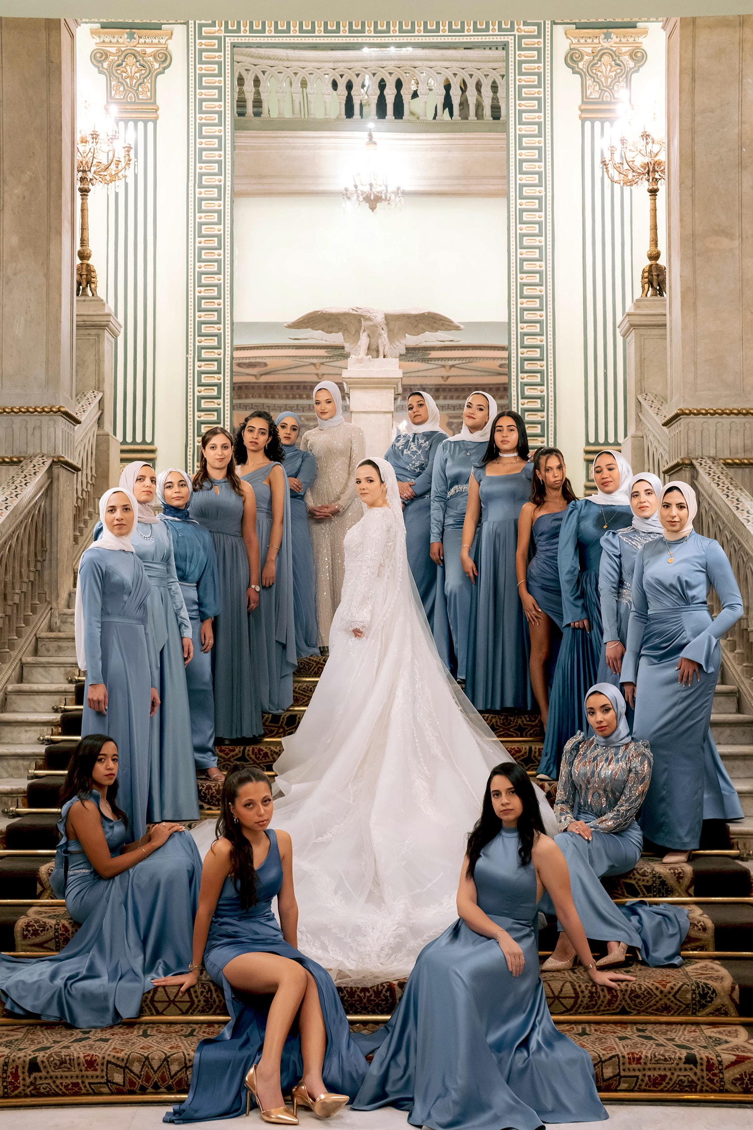 Bride surrounded by bridesmaids grand staircase
