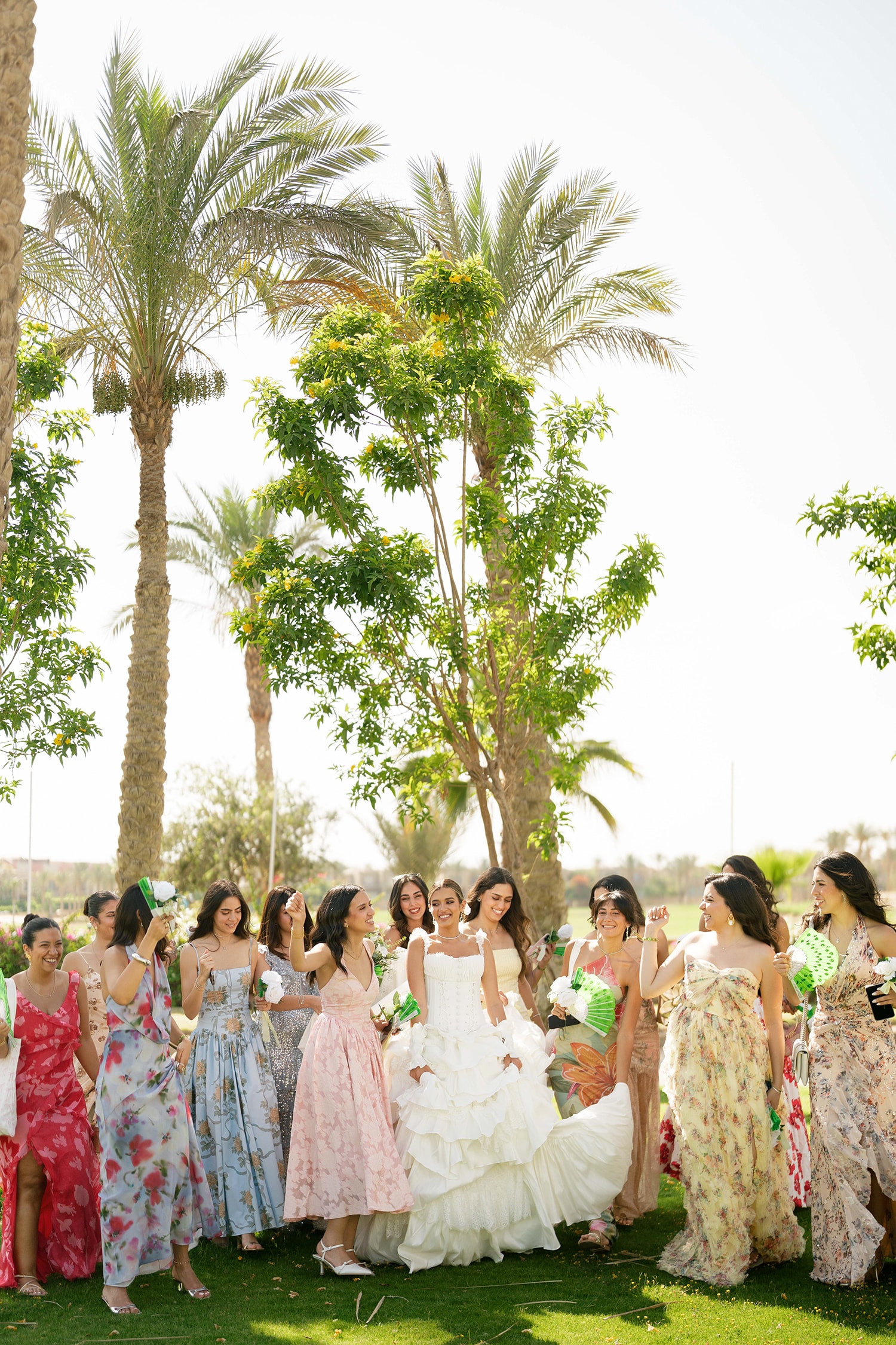 Bride and bridesmaids under palm trees